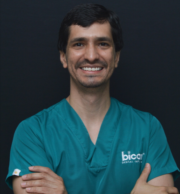 Daniel_Hernandez Daniel Hernandez, prosthodontist, faculty member in teal scrubs